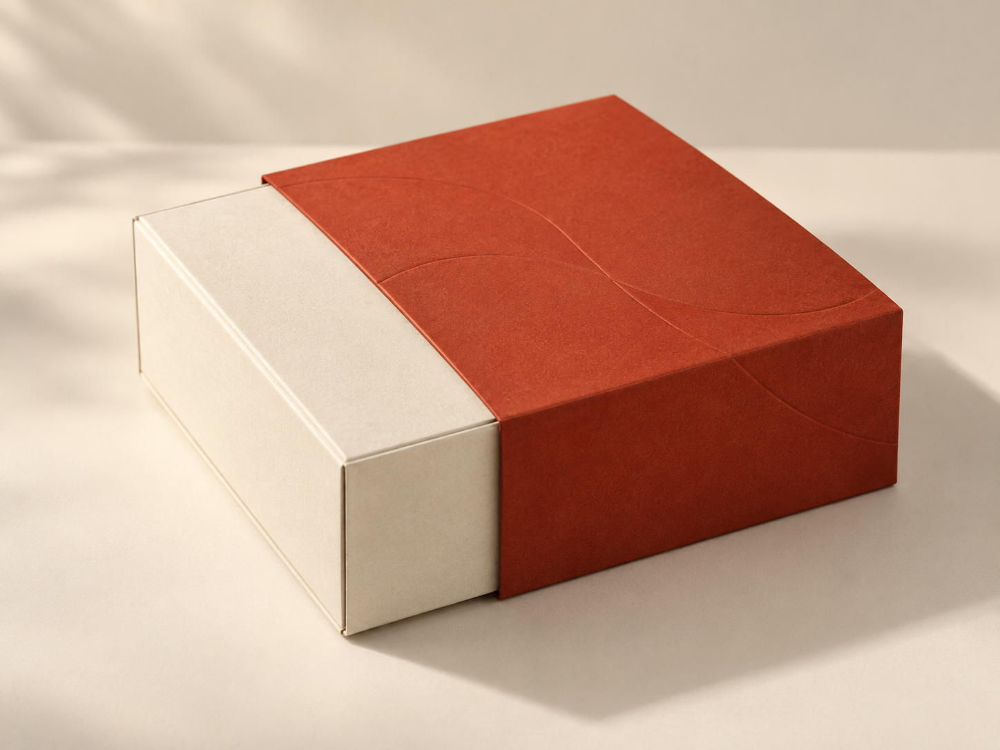 Candle sleeve carton concept in textured paper, shown in a three-quarter studio view.